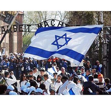 Jews walking proudly through the gates of Auschwitz as participants in the March of the Living.