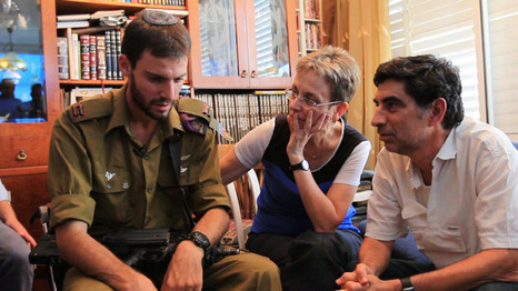 Lt. Eitan with Hadar Goldin's parents. After leaving Gaza Eitan went straight to Hadar's parents, he didn't go home, he didn't rest. He came to speak with them, to bring them a few things he found that belonged to their son and give them a firsthand account of what happened to Hadar, They wanted to see him, to hug him and say "Thank you."