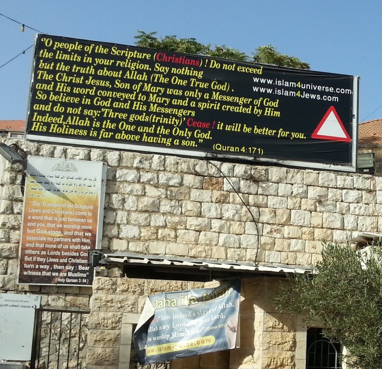 signs in front of the Basilica of the Annunciation