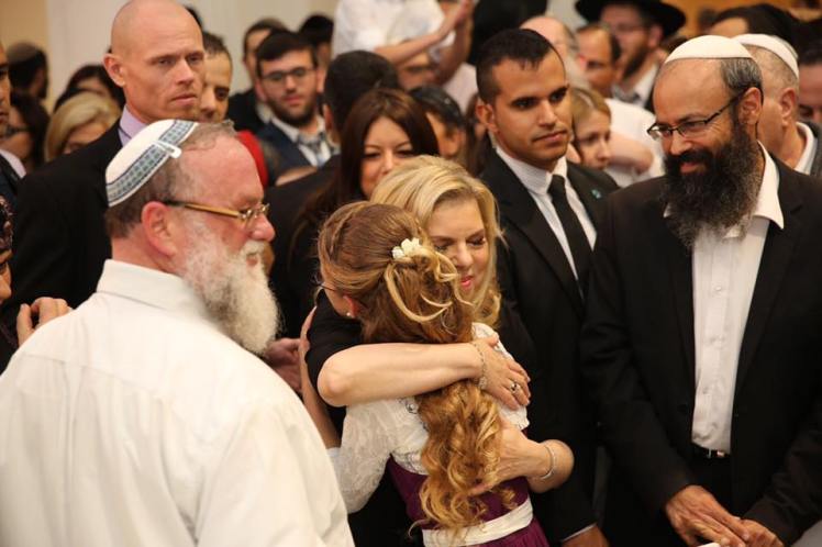 I’m hugging you in my name, in the name of the prime minister and in the name of all of Israel,” she said while embracing the bride. “I hope you will build a faithful home in Israel.