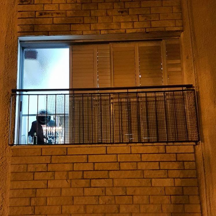 lighting Chanukah candles by Forest Rain